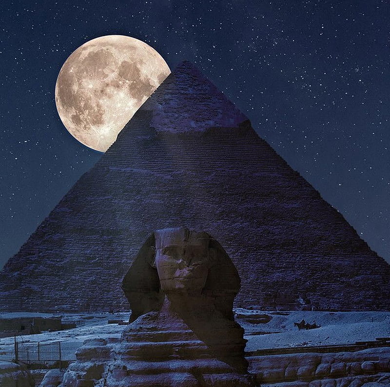 A full moon over the pyramids of giza